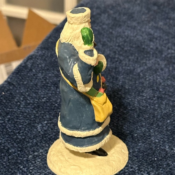 Blue robed Santa with green mittens holds a doll & basket of fruit. - Picture 4 of 7